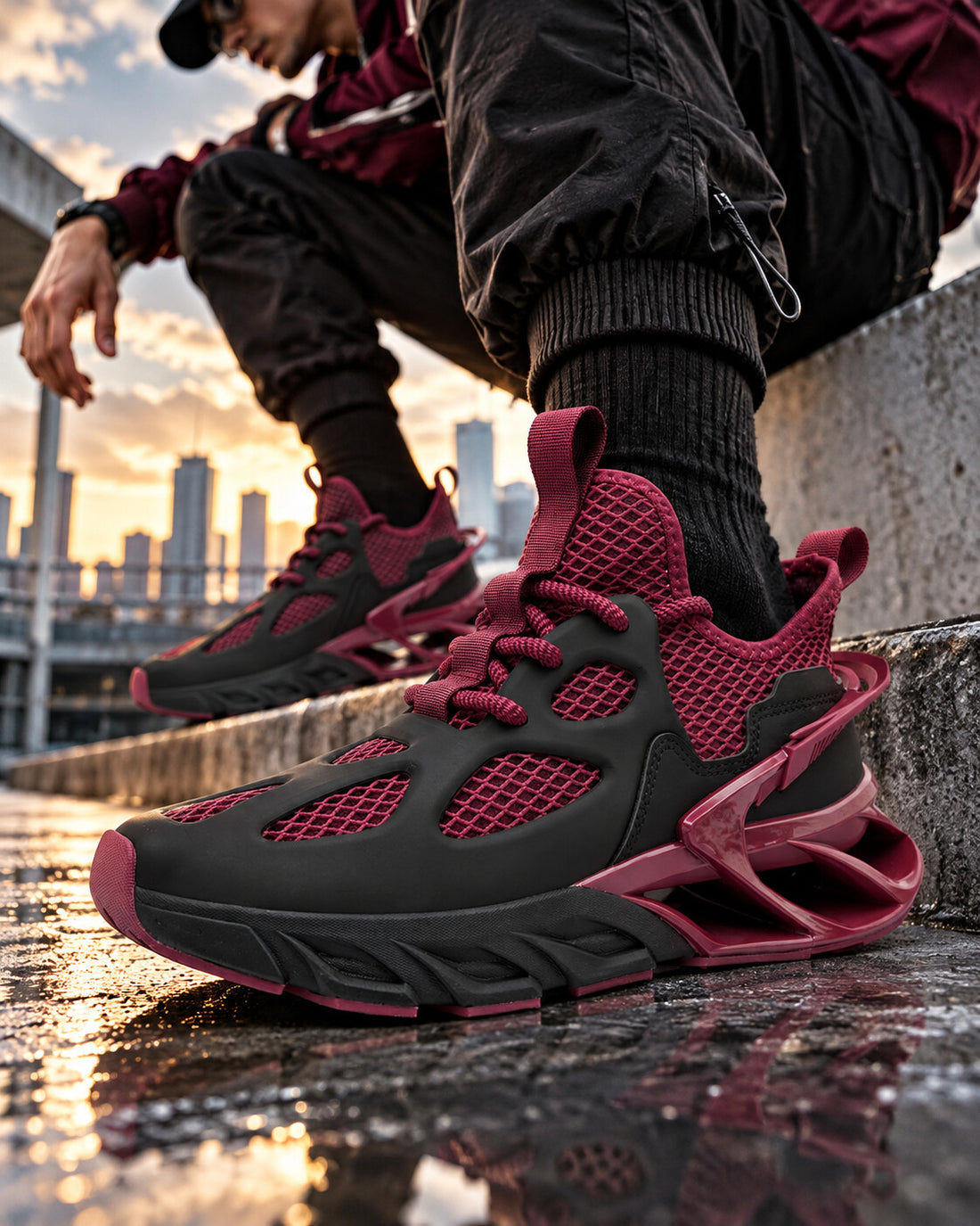 Quantum Manor X9X sneakers in Graphite Black and Burgundy on wet city steps at sunset